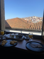 A group of professionals networking over breakfast at a table.