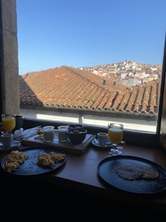 Guests enjoying breakfast in a bright, stylish hotel dining room.