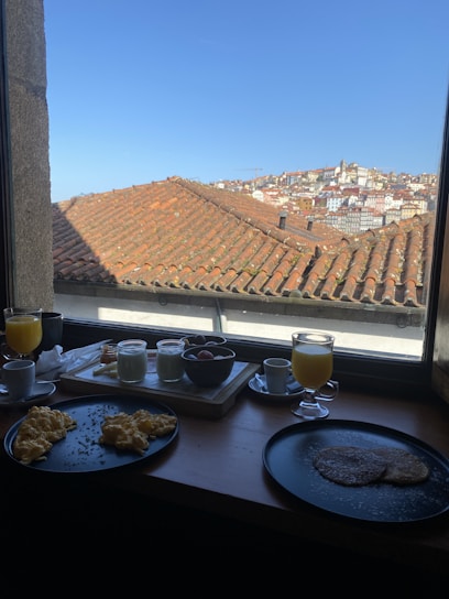 Guests enjoying breakfast in a bright, stylish hotel dining area.
