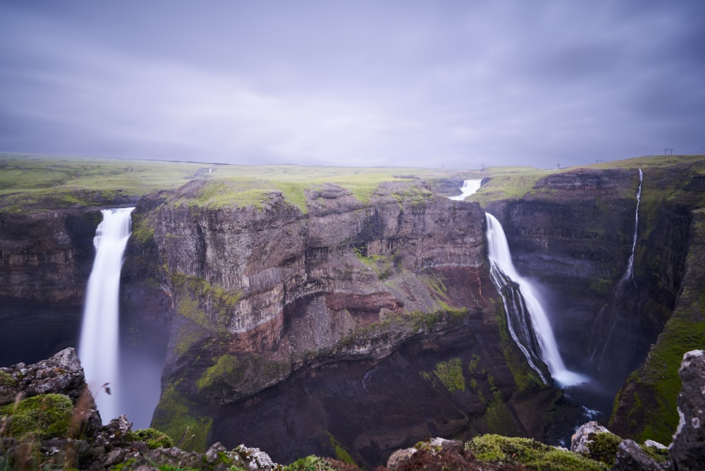 a large waterfall with a waterfall in the middle of it