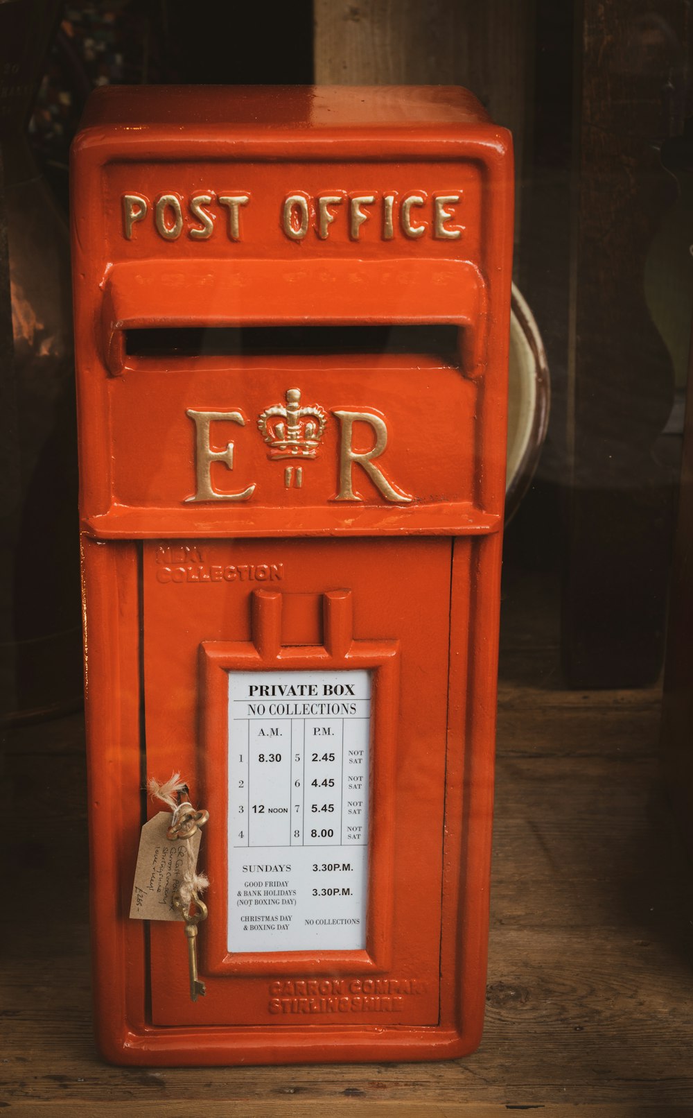 a red post office box with a key on it