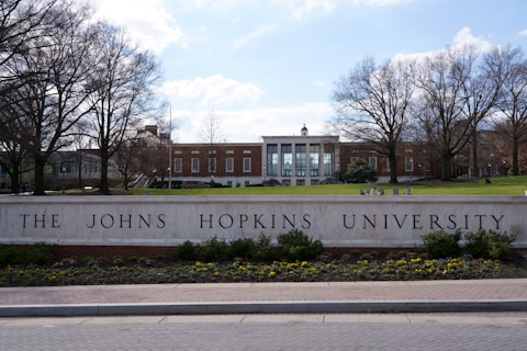 the johns hopkins university sign in front of a brick building