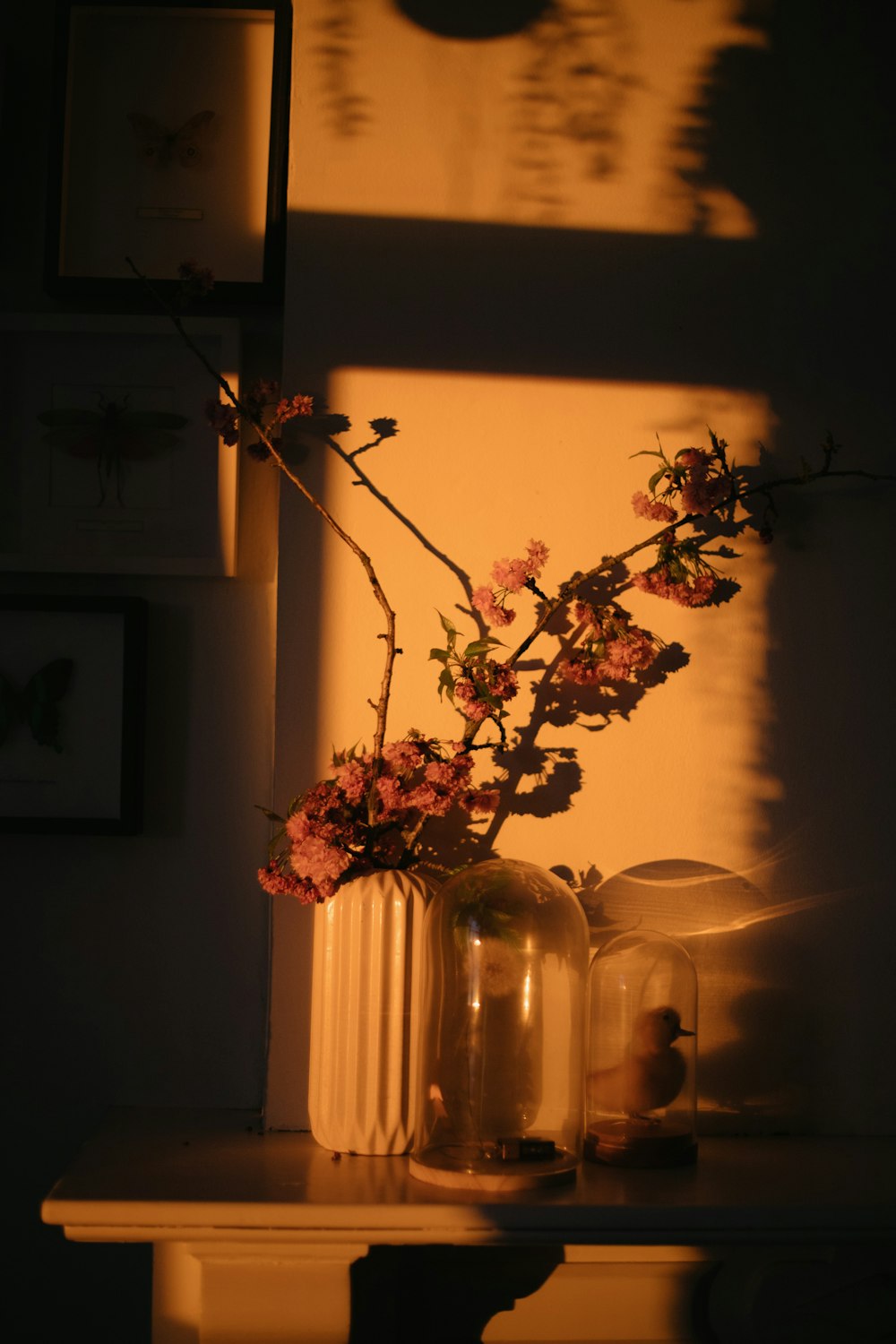 a vase filled with flowers sitting on top of a table