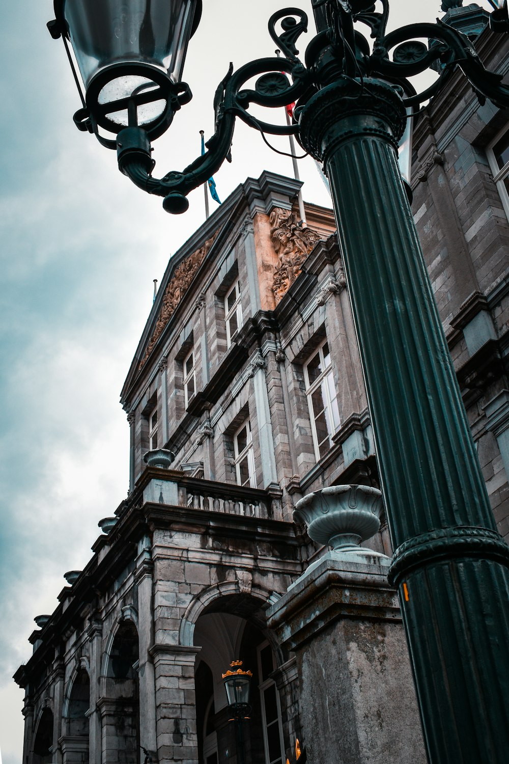 a street light in front of an old building