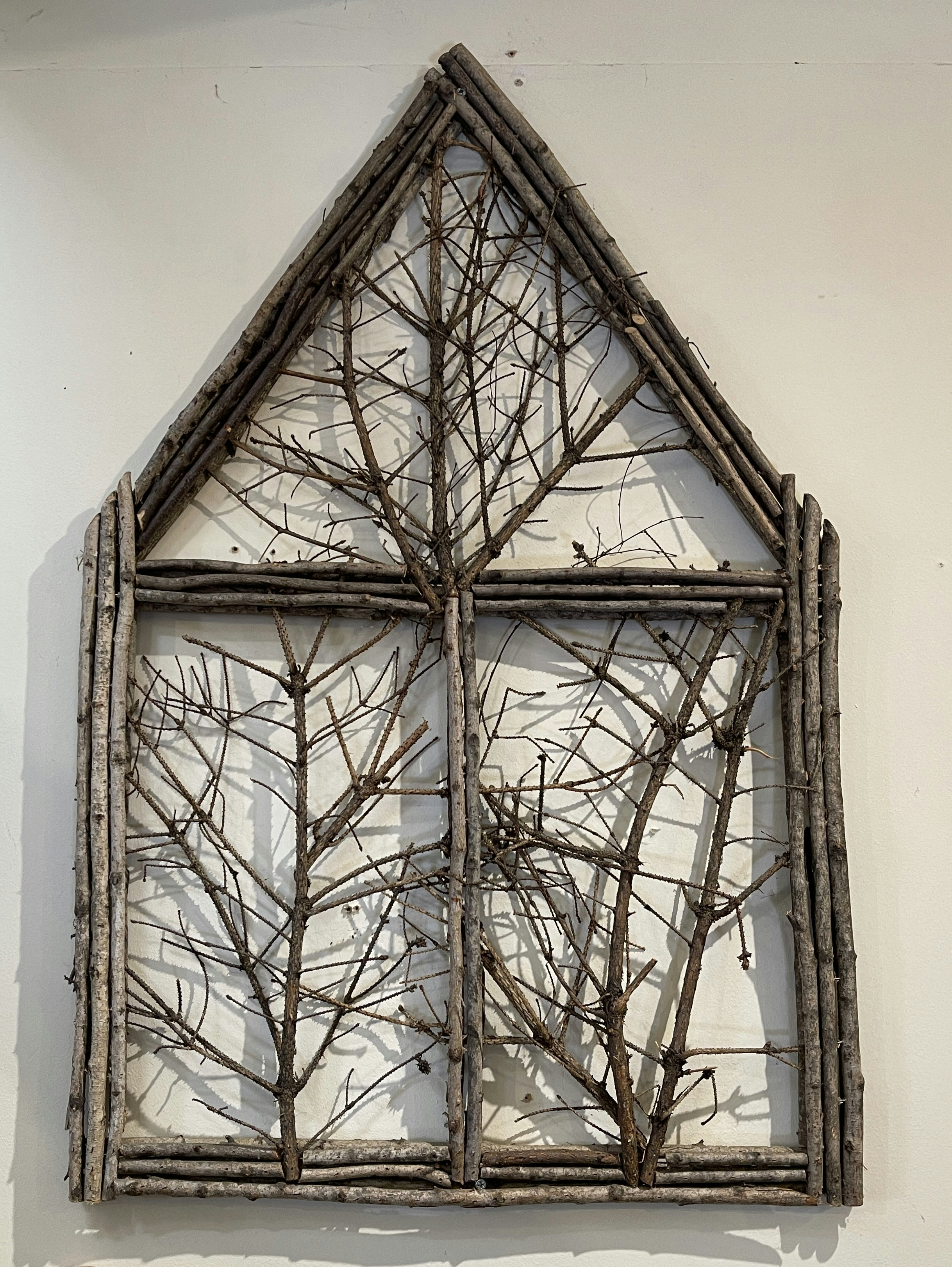 A picture of a window made out of branches photo – Free Art Image on ...
