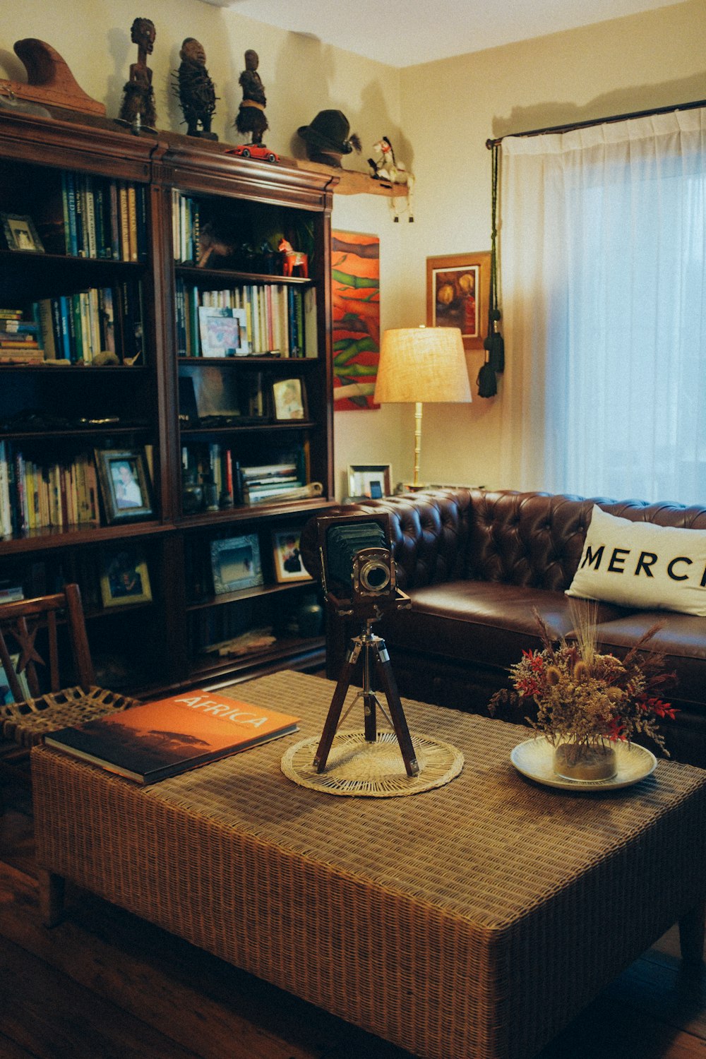 a living room filled with furniture and a book shelf