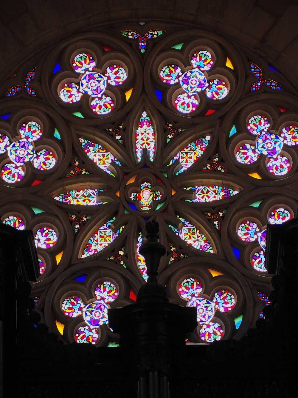 a large stained glass window inside of a building