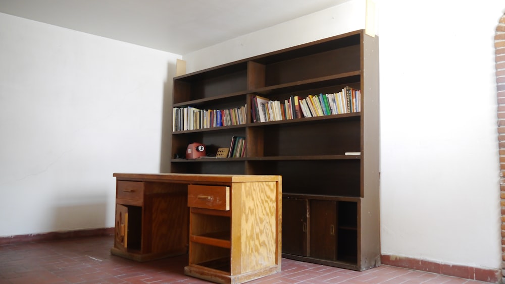 a desk and bookcase in a room