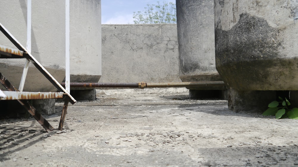 a concrete building with a pipe sticking out of the ground