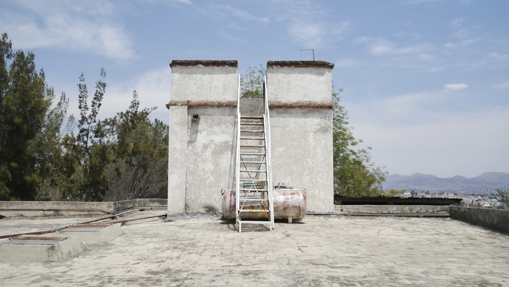 a ladder leaning against a building with a ladder