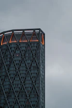 a very tall building with a sky in the background