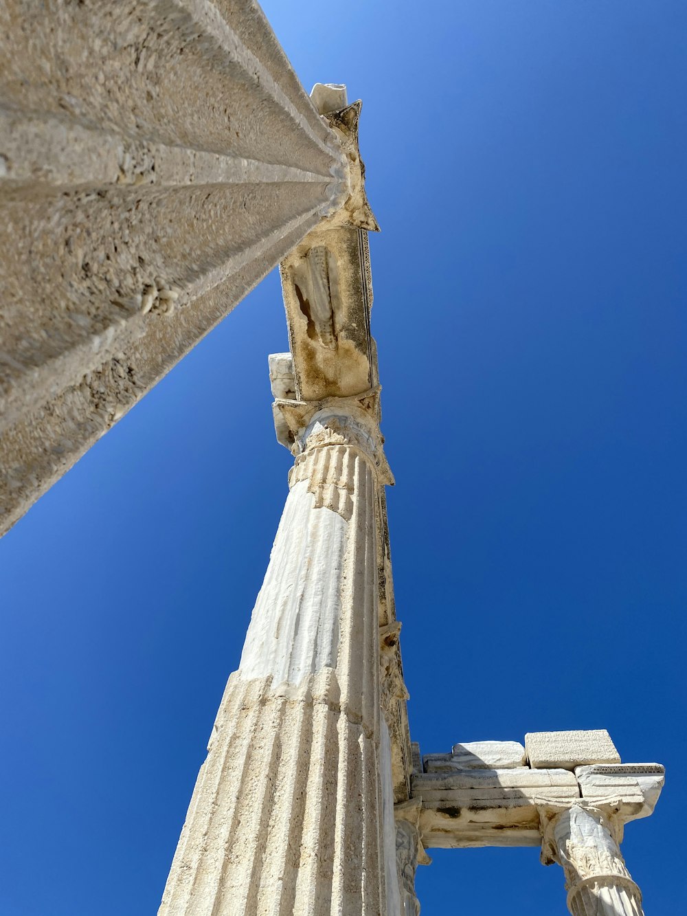 a tall column with a sky in the background