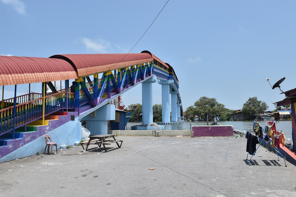 a colorful building with a rainbow colored roof