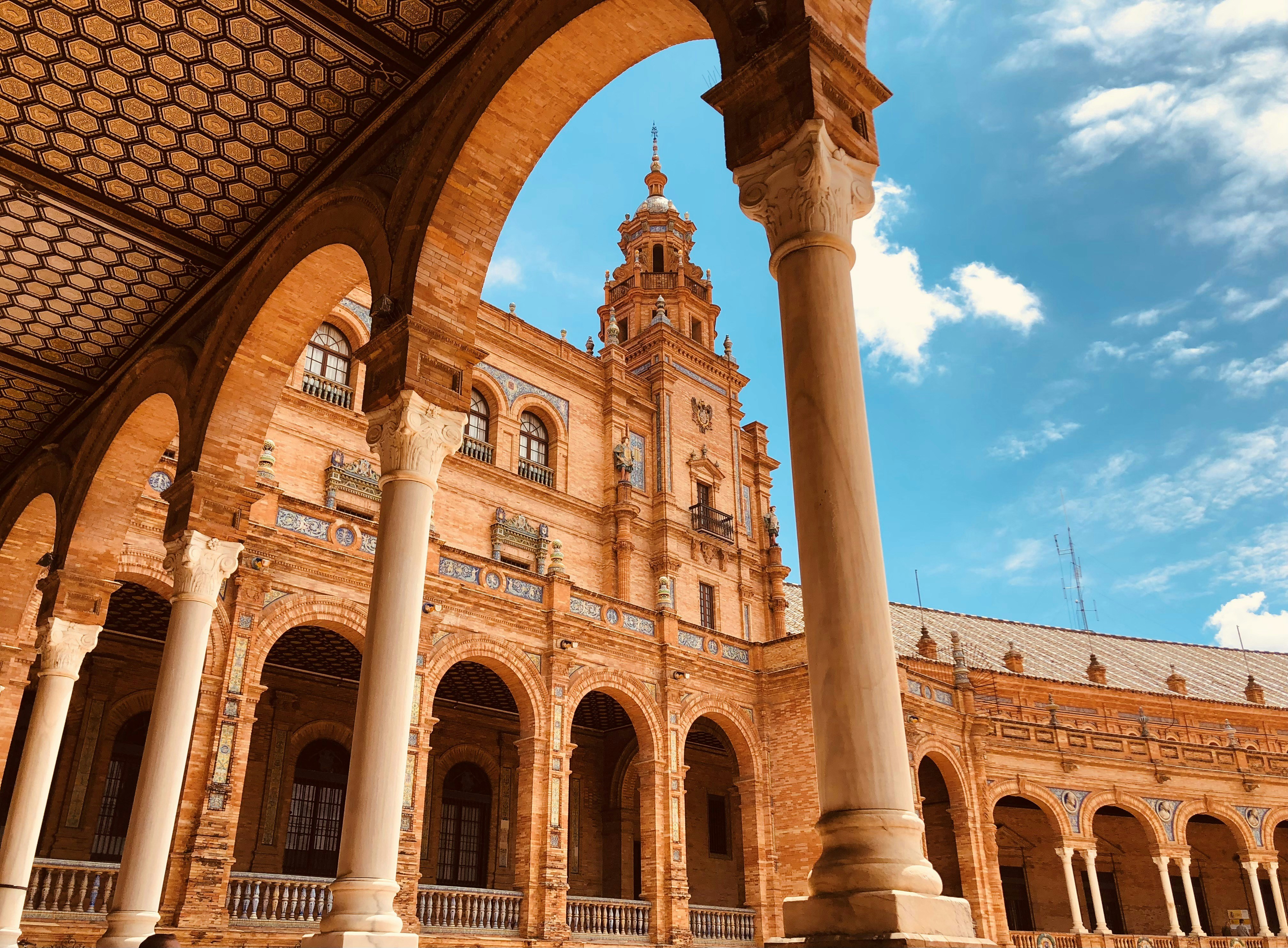 a large building with columns and a clock tower