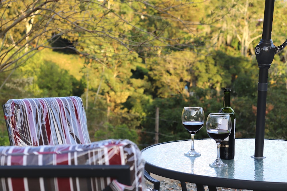 a couple of wine glasses sitting on top of a table