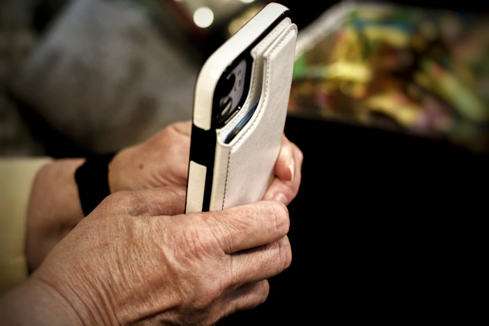 A close-up of a person holding a smartphone