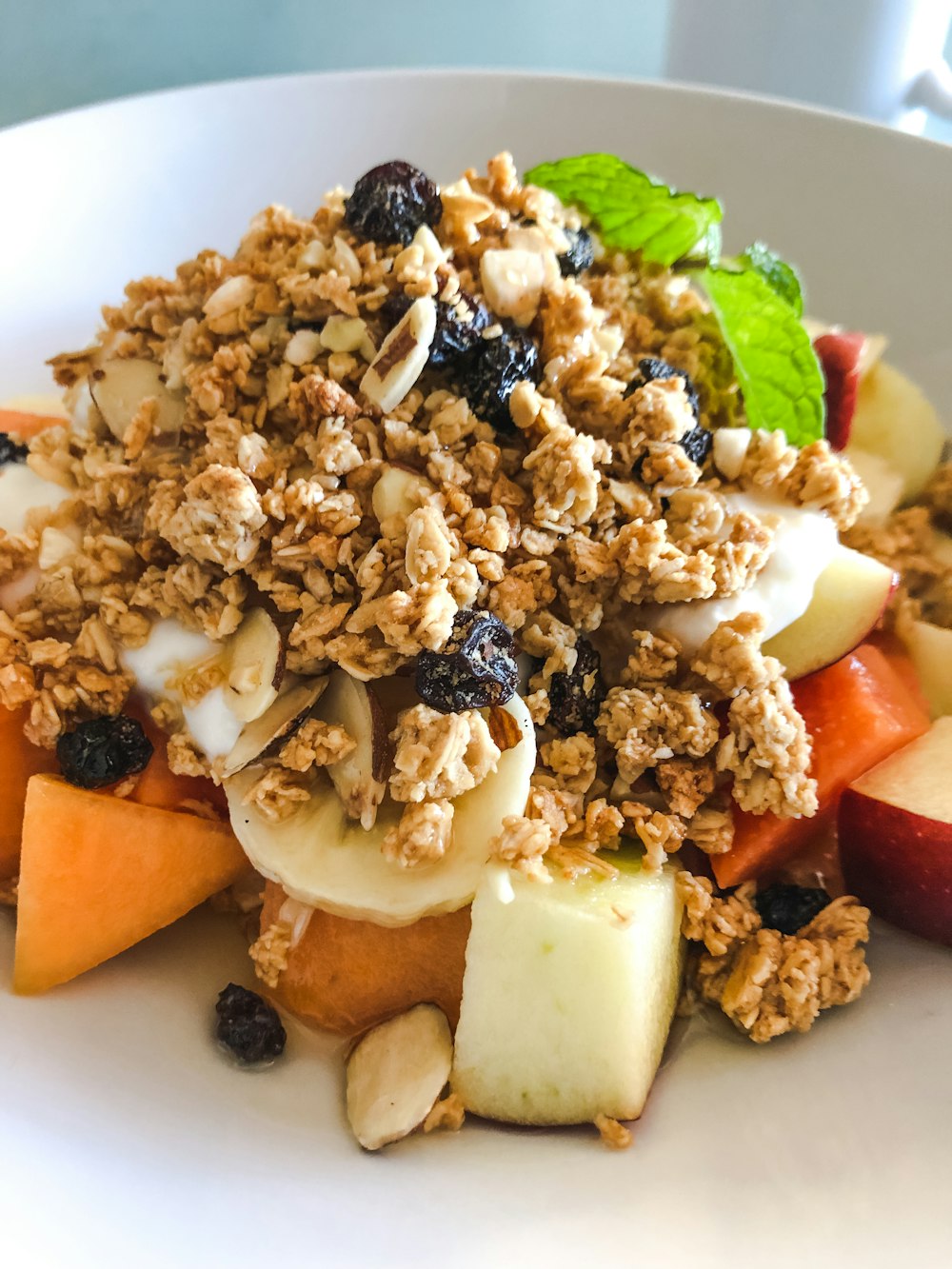 a close up of a plate of food with fruit