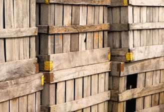 a pile of wooden pallets stacked on top of each other
