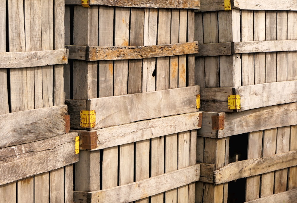 a pile of wooden pallets stacked on top of each other