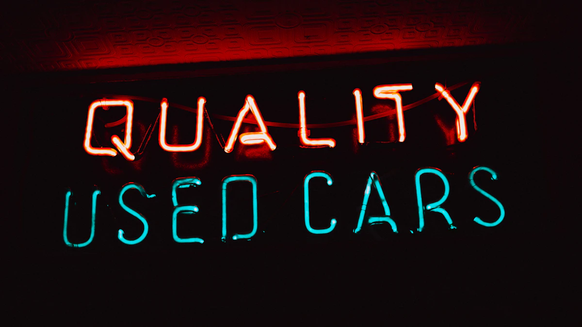 Neon sign reading Quality Used Cars