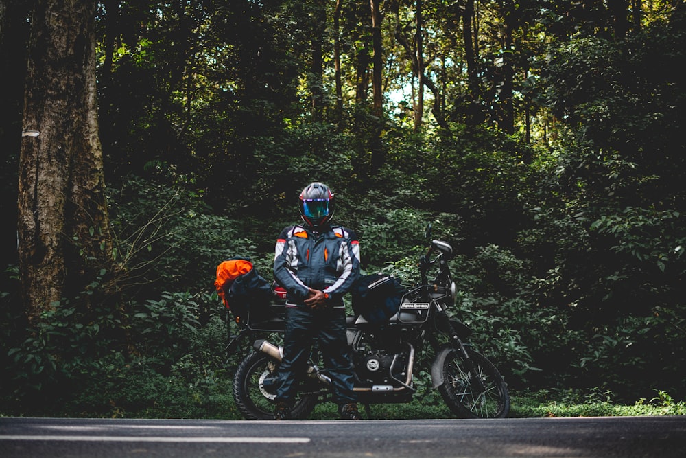 two people on a motorcycle in the middle of the road