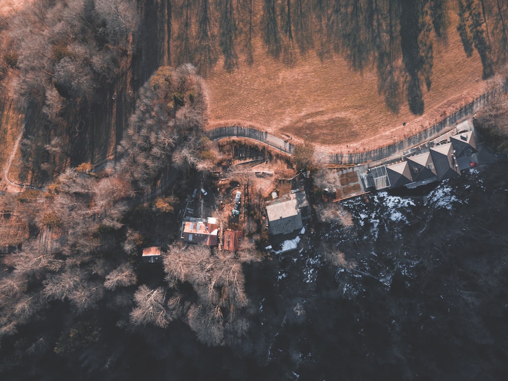 an aerial view of a house and a bridge