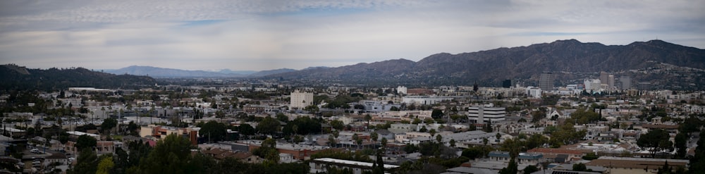 a view of a city with mountains in the background