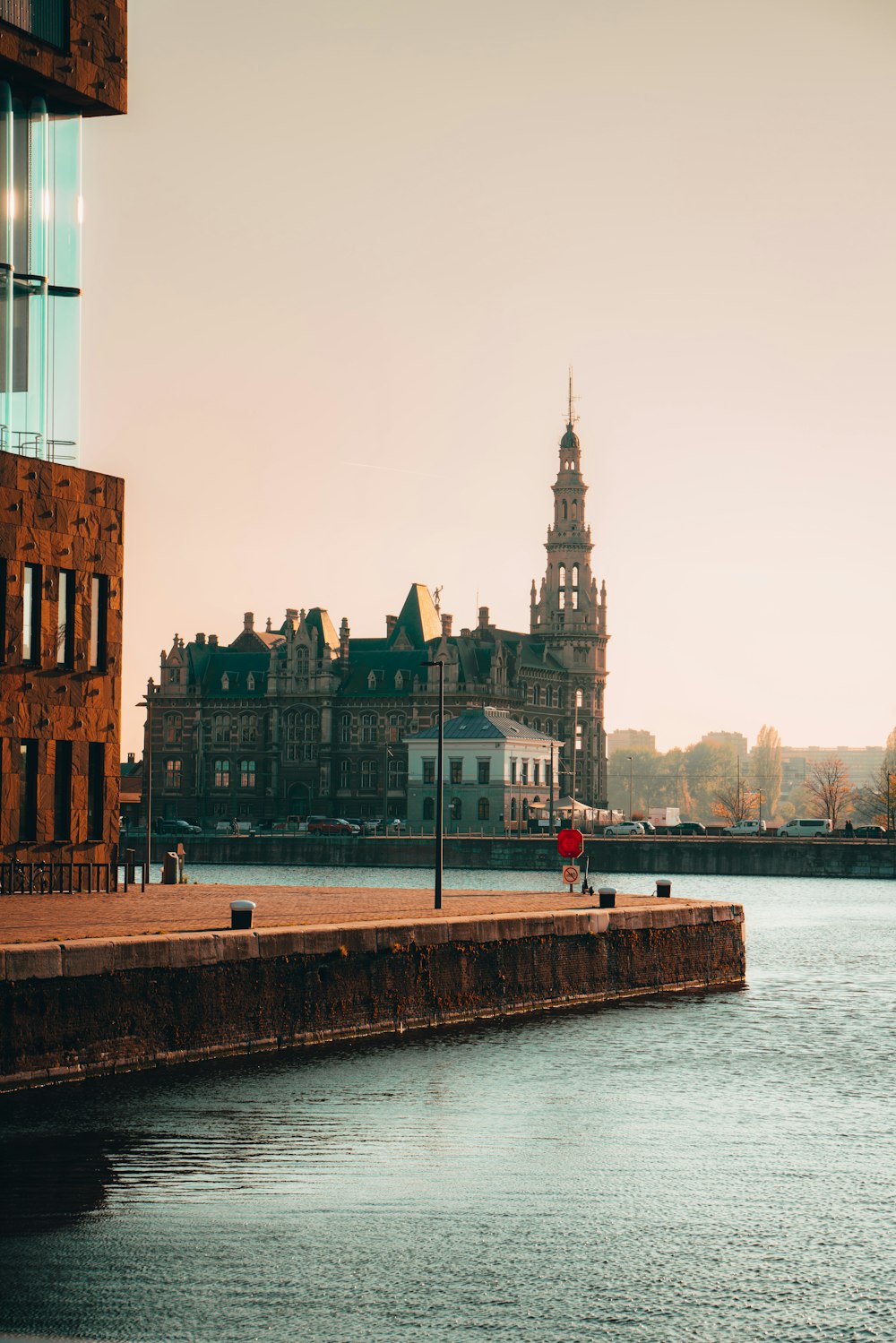 a body of water with a building in the background