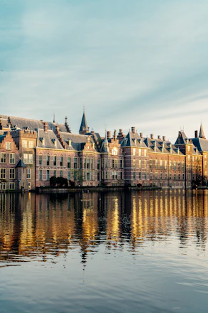 a large building sitting on top of a lake