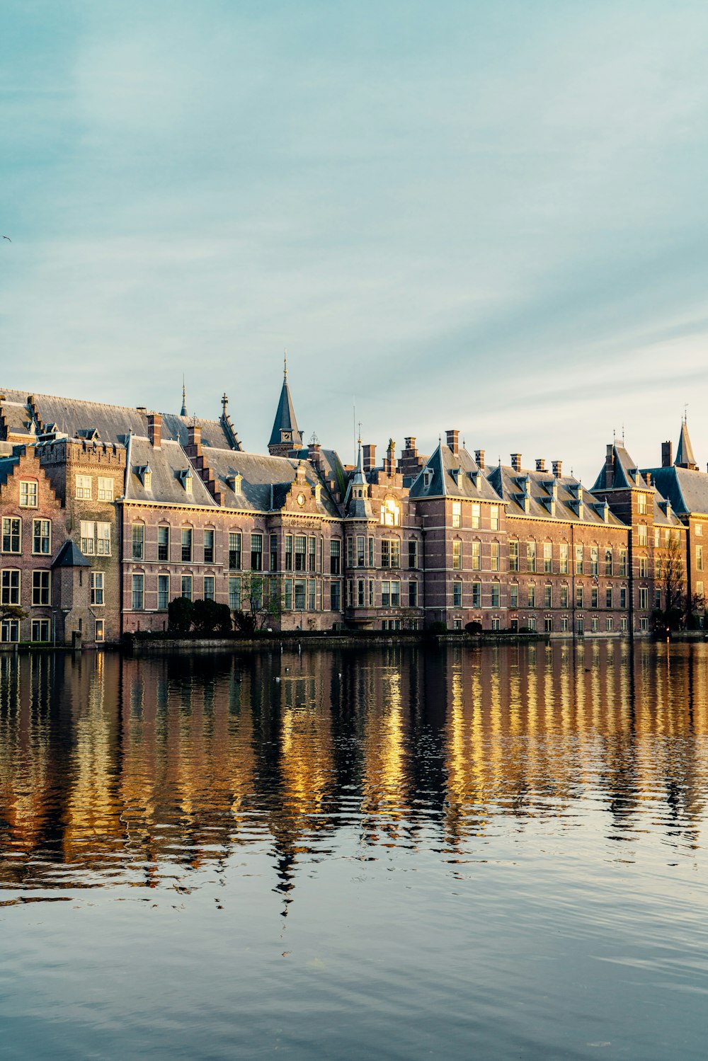 a large building sitting on top of a lake