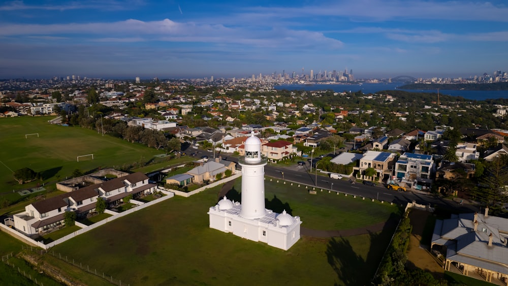 an aerial view of a city with a lighthouse