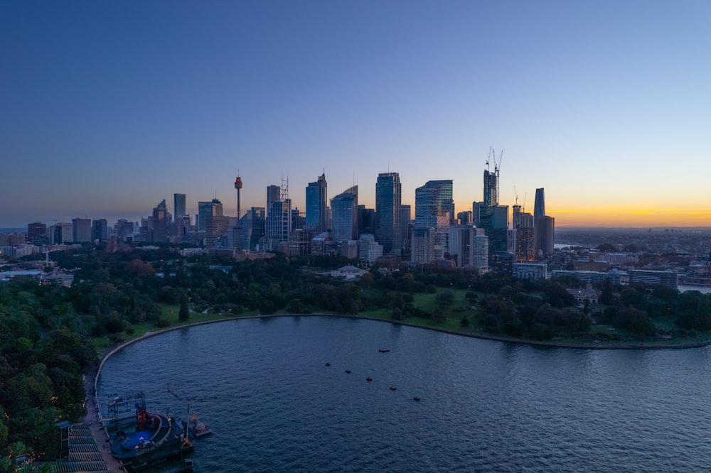 a large body of water with a city in the background