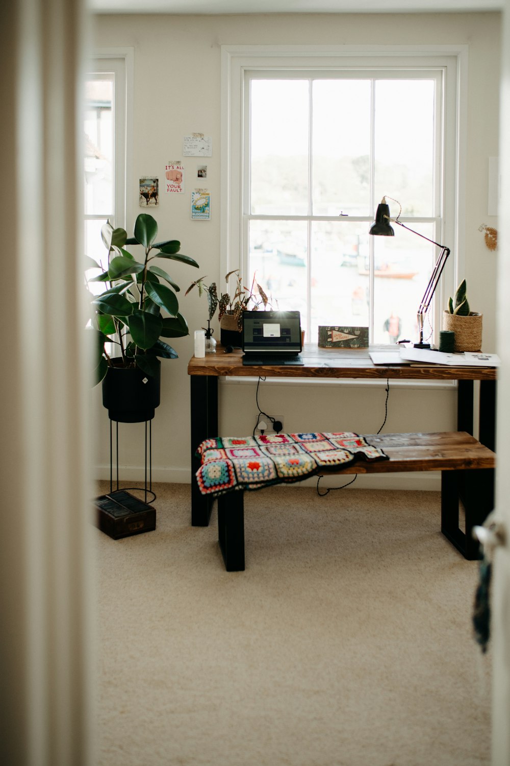 a room with a desk and a window