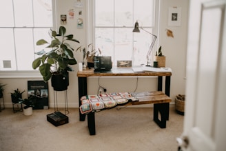 a room with a table and a bench in it