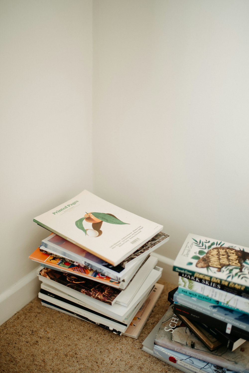 a stack of books sitting on top of a floor