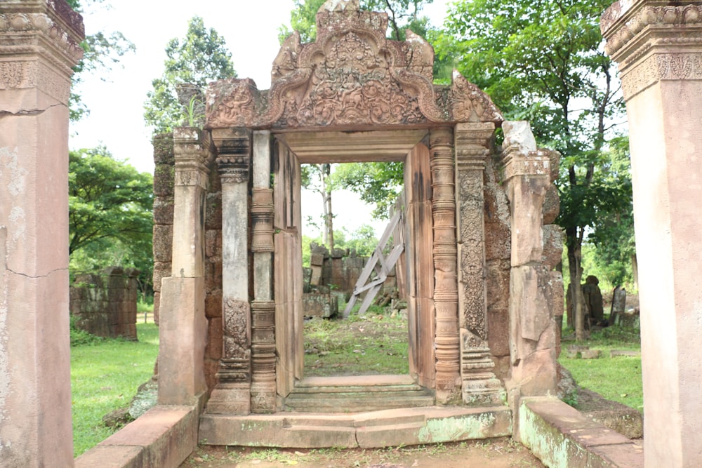 a doorway in the middle of a cemetery