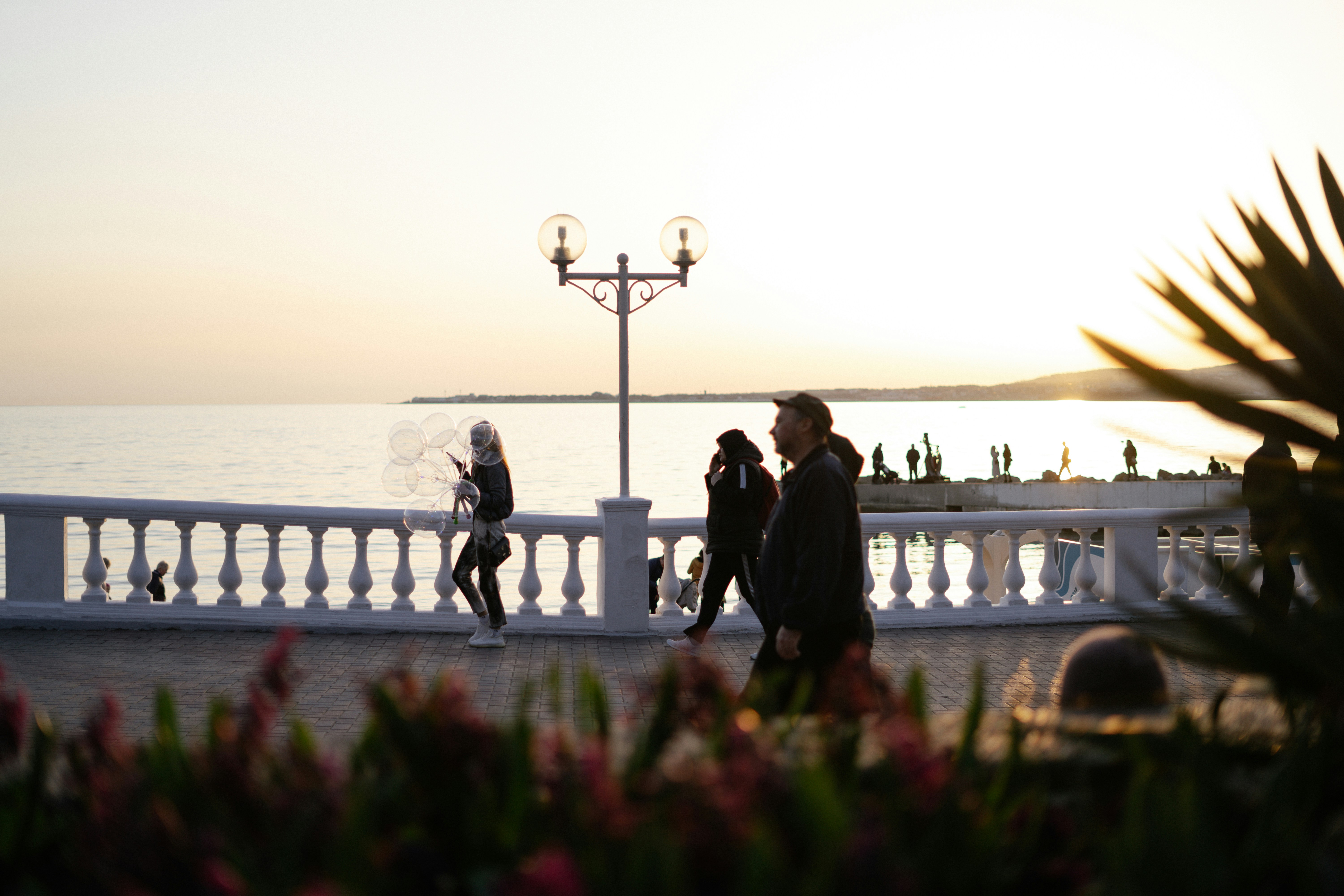 a group of people walking on a bridge