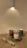 Image of a cozy kitchen setting with a freshly baked cake on a wooden table.