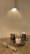 Image of a cozy kitchen setting with a freshly baked cake on a wooden table.