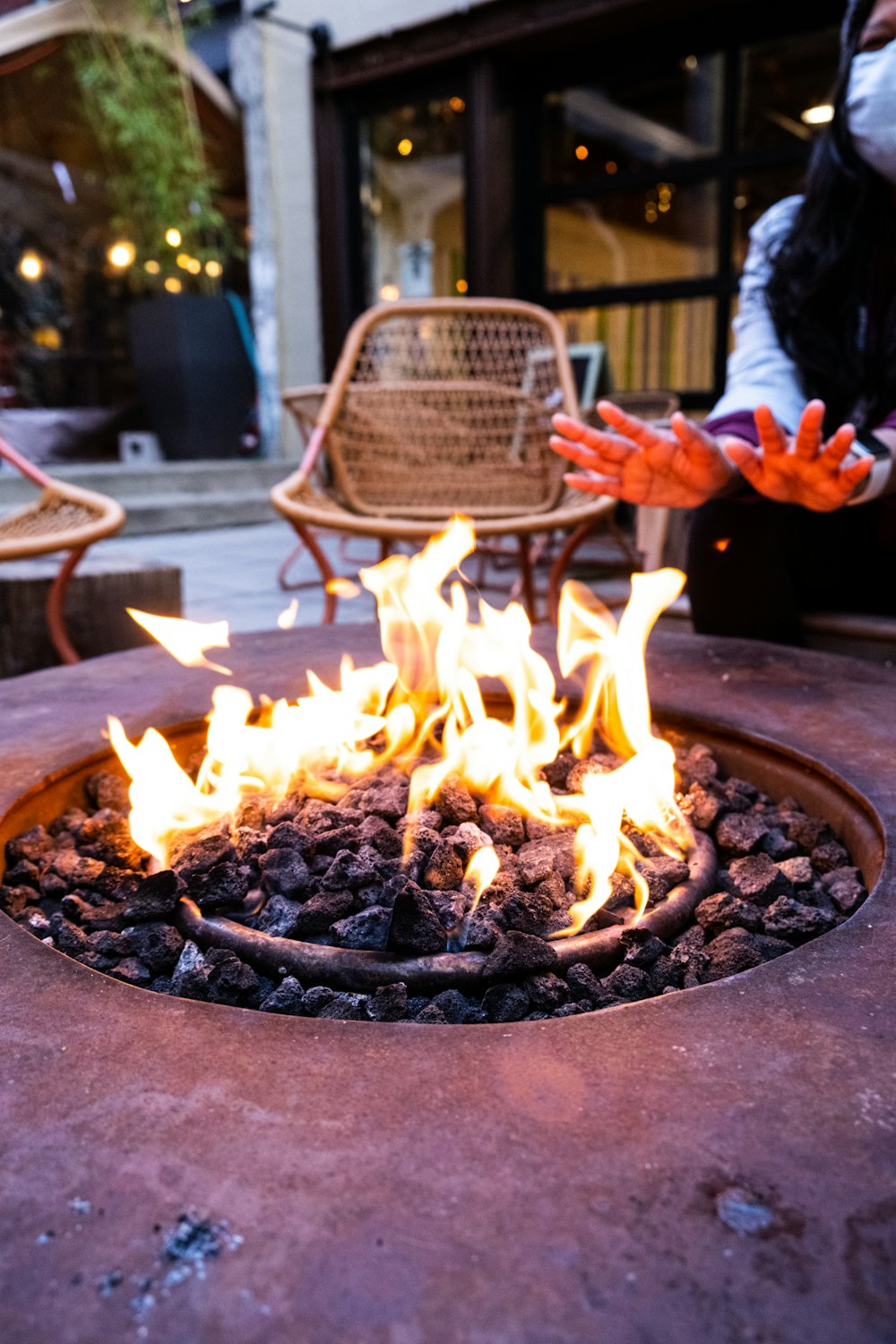 a fire pit sitting on top of a stone table