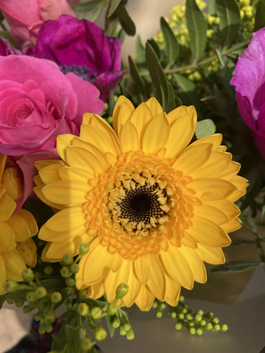 A colorful birthday floral arrangement featuring gerberas and alstroemerias.