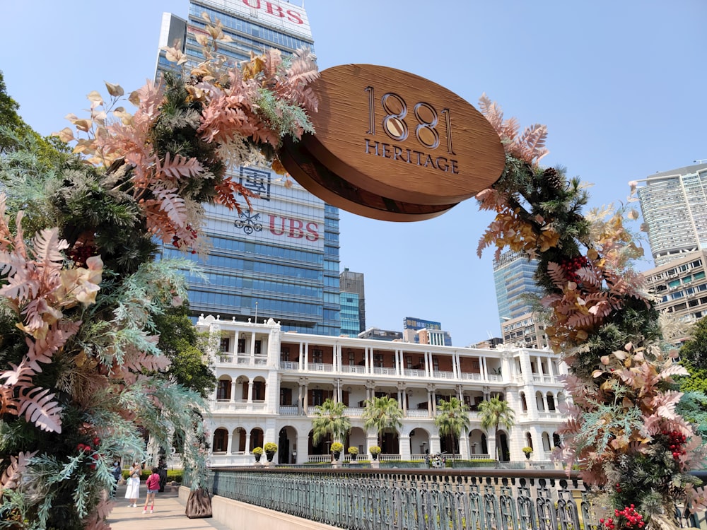 a building with a wooden sign hanging from it's side