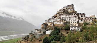 a mountain with a bunch of buildings on top of it