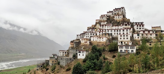 a mountain with a bunch of buildings on top of it