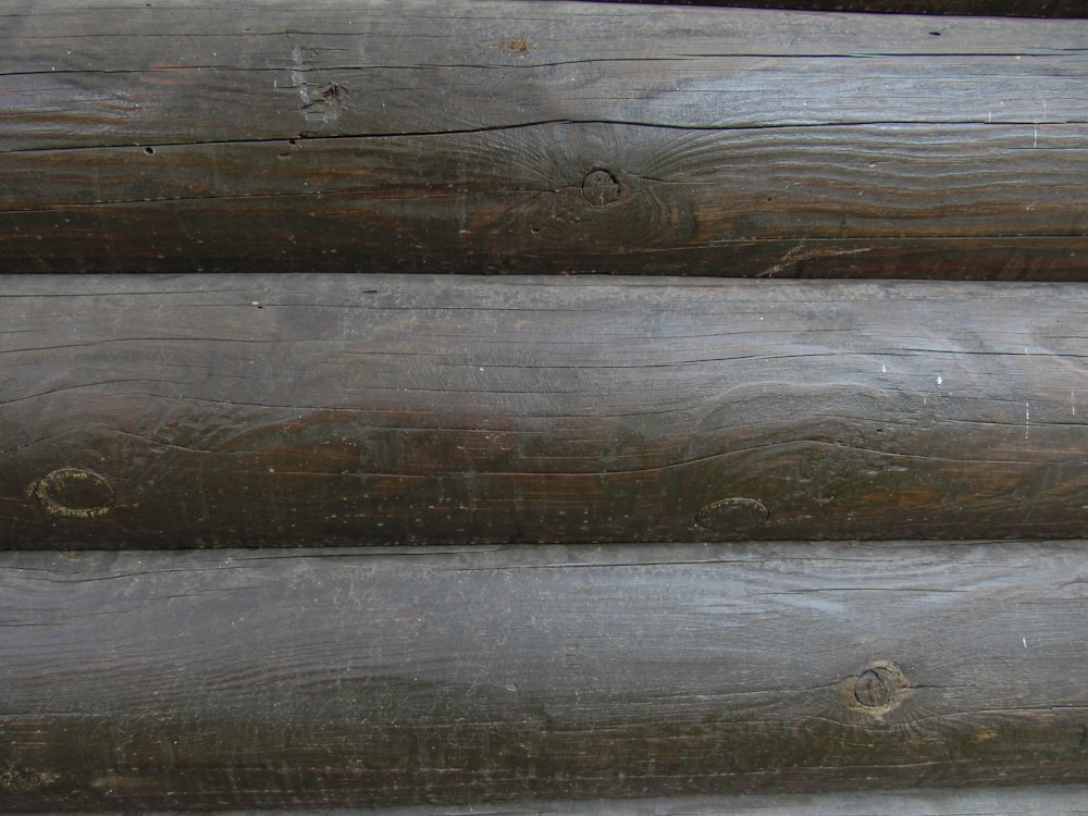 a close up of a wooden wall with wood planks