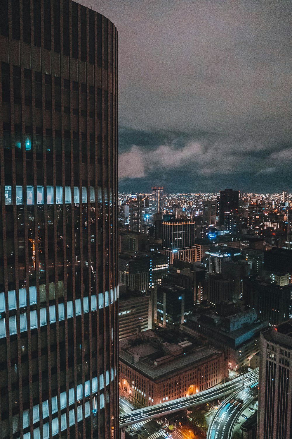 a view of a city at night from the top of a building