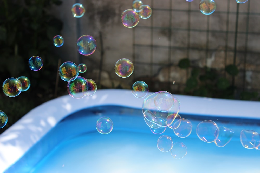 soap bubbles floating in a pool of water