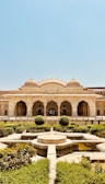 a large building with a fountain in the middle of it