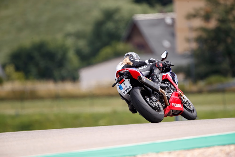 a person riding a motorcycle on a race track