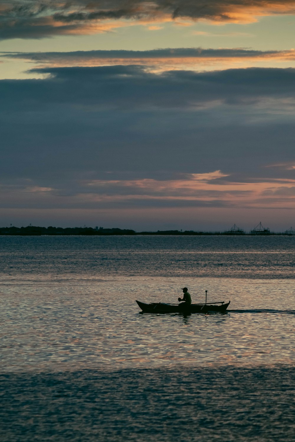 a person in a boat on a body of water